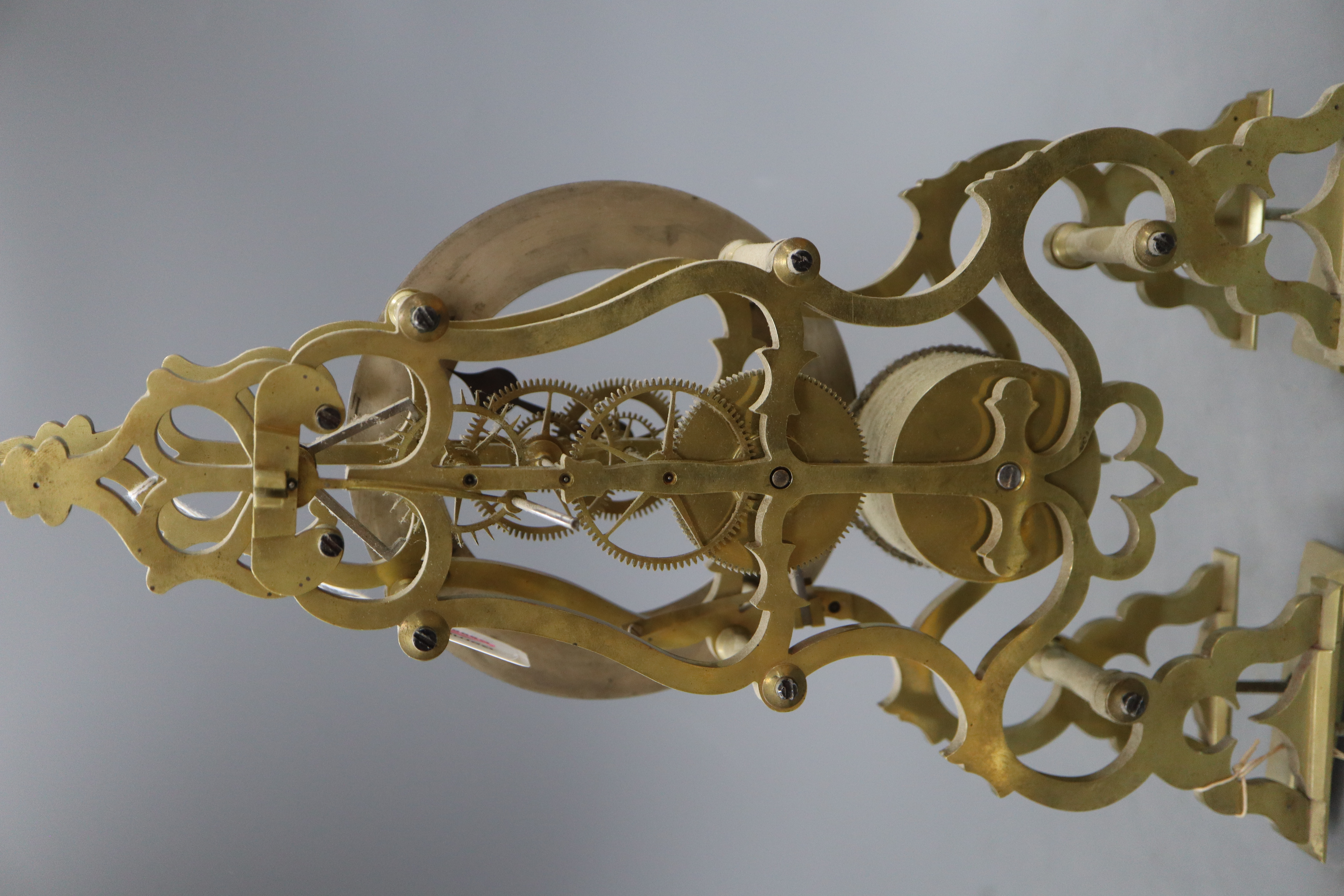A late 19th / early 20th century brass skeleton clock, with single chain fusee movement, lacking pendulum and base, H.42.5cm